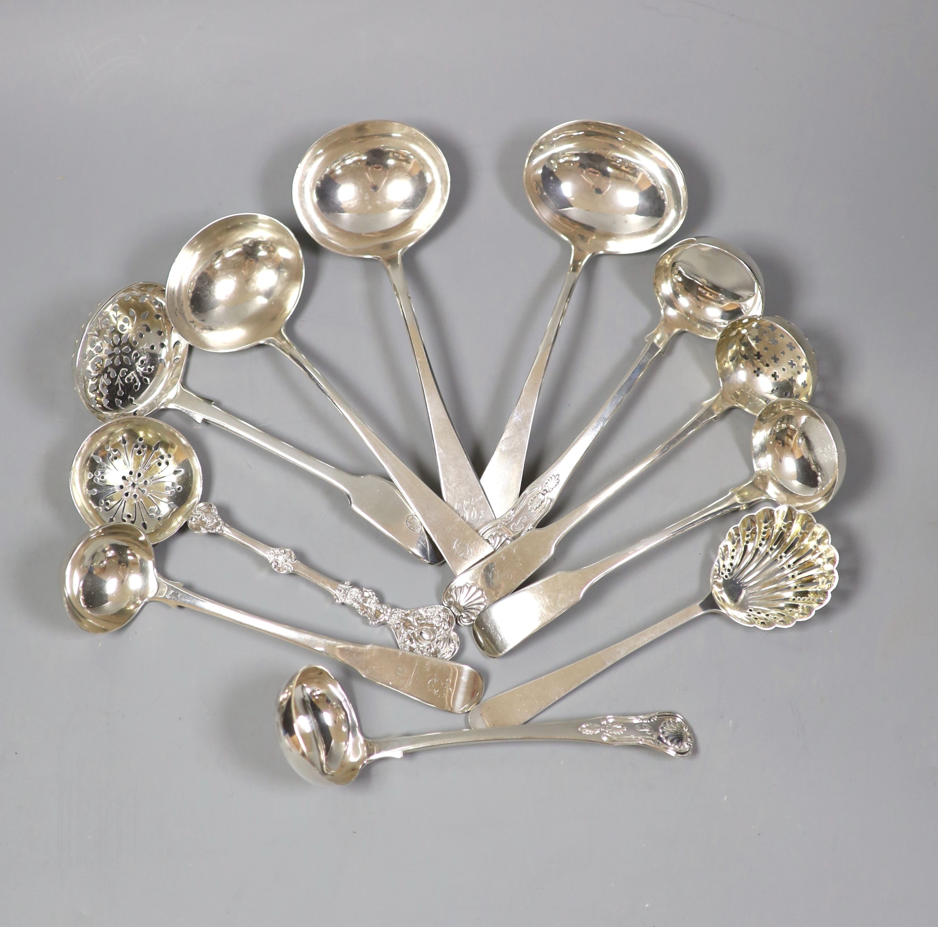 Eleven assorted 19th century and later silver suace and sifter ladles, various dates and makers, 13.5oz.